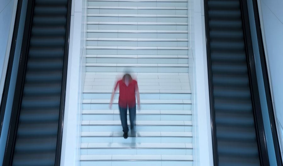 Burry picture of a man walking down the stairs