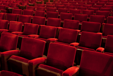 Red seats inside a theatre